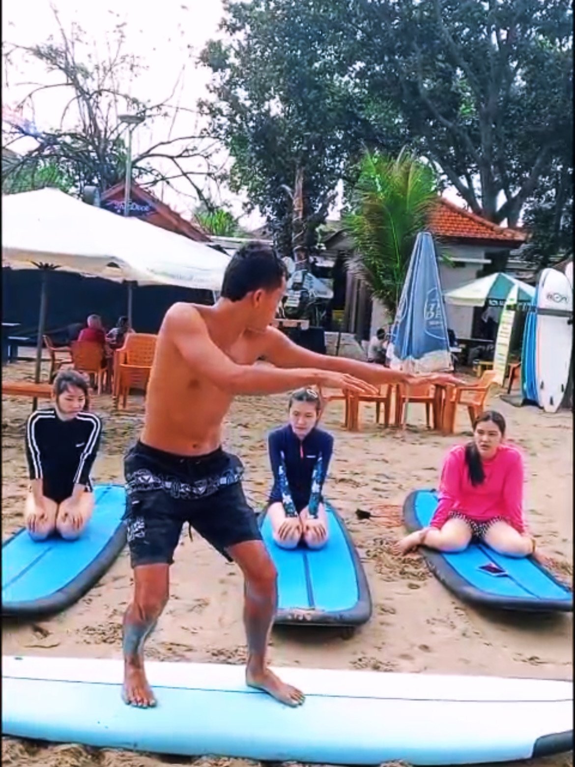 Rock Mini Surf instructor teaching students on the beach